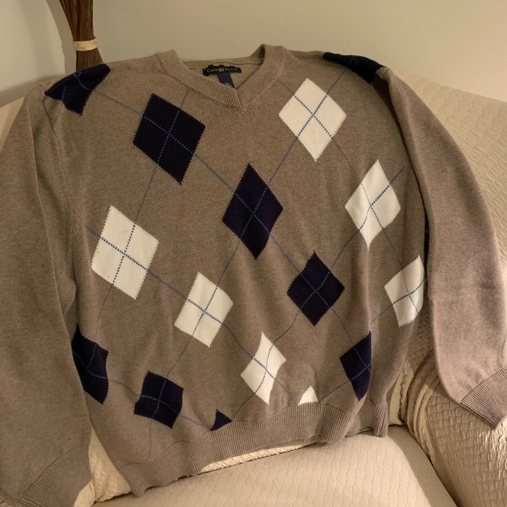 Tan, navy and cream color argyle style sweater.